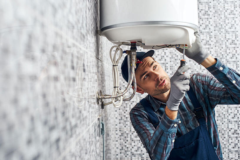 Man servicing electric boiler