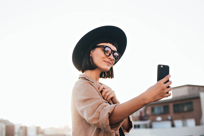 Social media influencer creating content on their phone