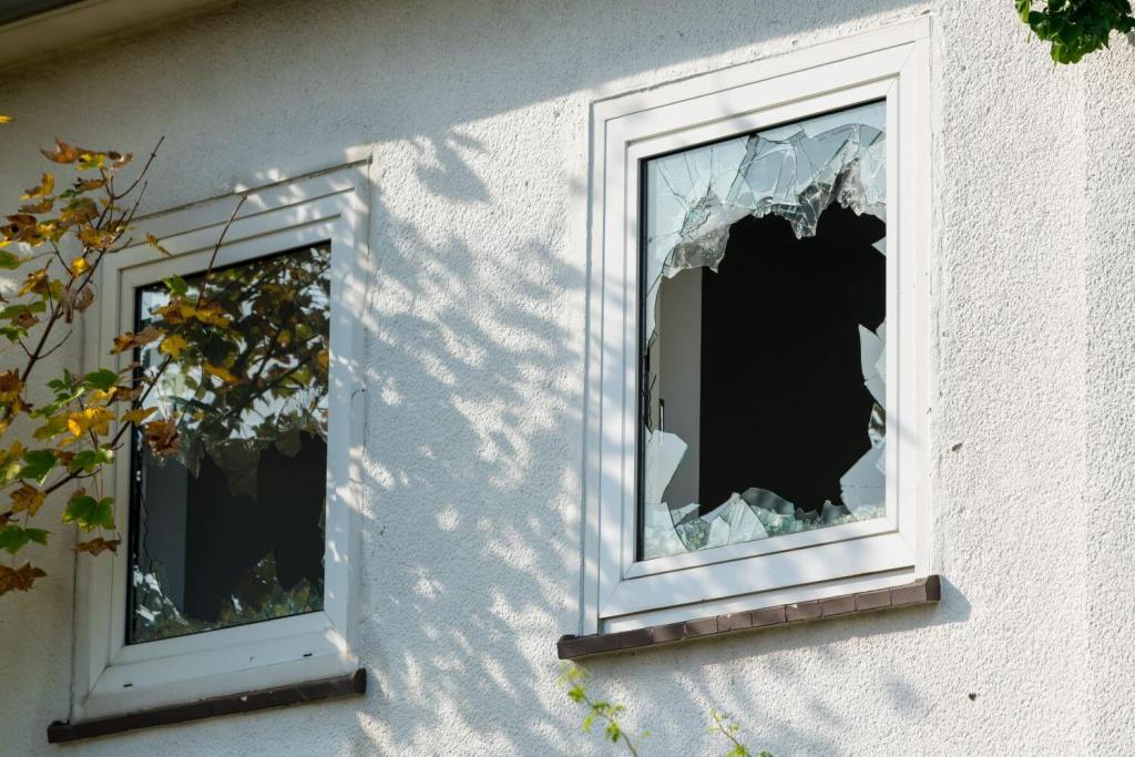A broken window on a rental property