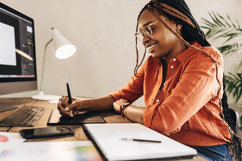Woman designing on tablet