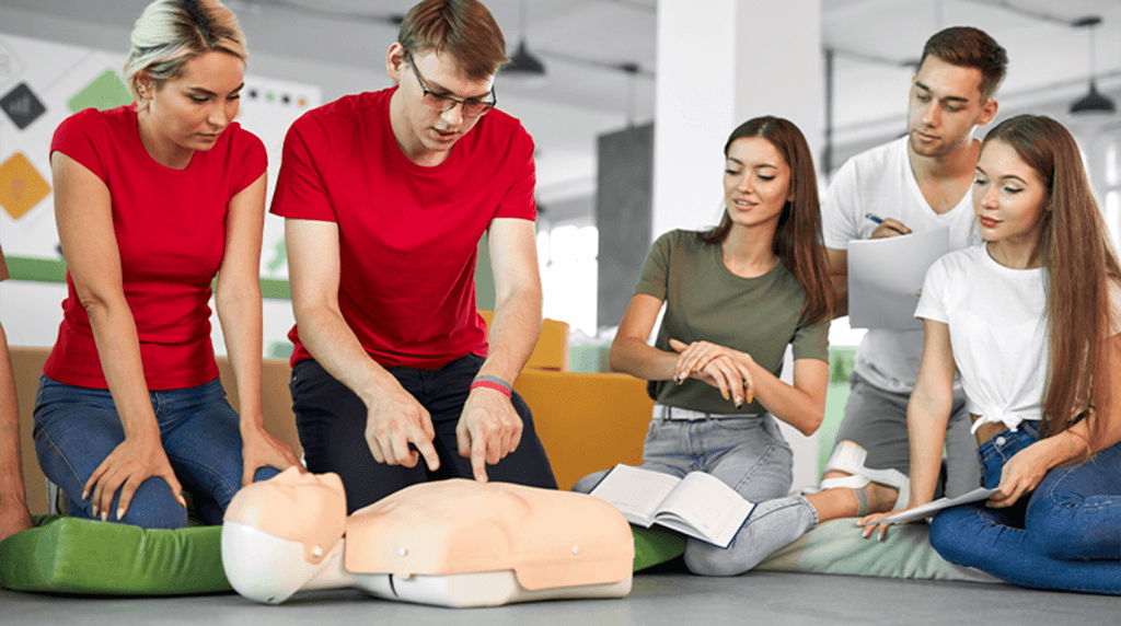 First aider demonstrating how to give CPR
